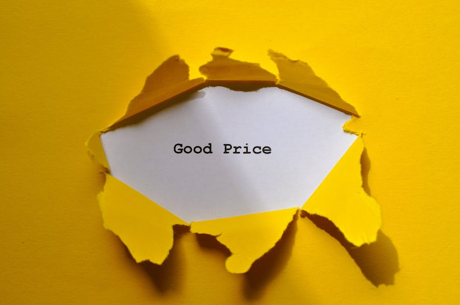 Yellow torn paper revealing 'Good Price' text, perfect for sales and marketing themes.