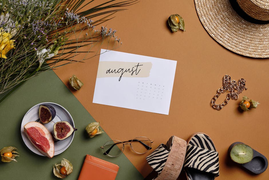 Aesthetic summer arrangement with fruits, flowers, and August calendar.