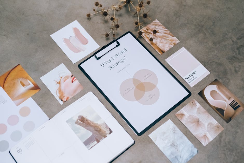 Flat lay of a minimalist brand strategy moodboard on a concrete surface.