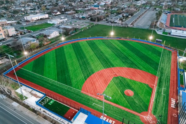 Aerial shot of a well-maintained baseball field in Grant neighborhood, Sacramento, during the day.