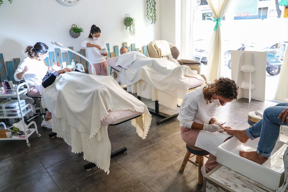 Peaceful spa scene with professionals giving facial and pedicure treatments in a well-lit salon.