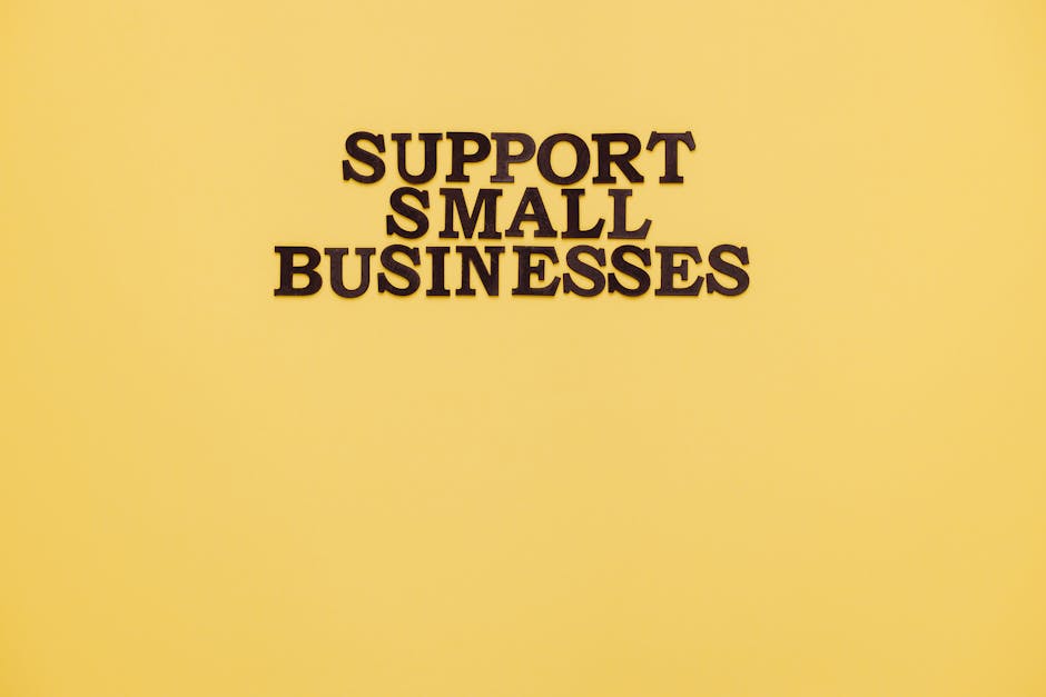 Inspirational image with 'Support Small Businesses' text on a warm yellow background.