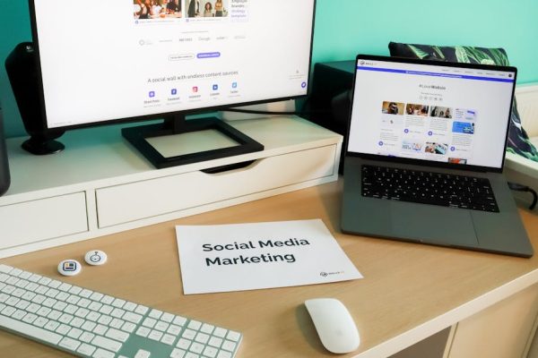 Stylish workspace with laptop and monitor for social media marketing.