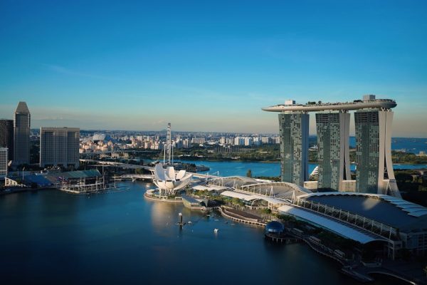 Discover Singapore's iconic cityscape with Marina Bay Sands, a stunning view from above on a clear day.