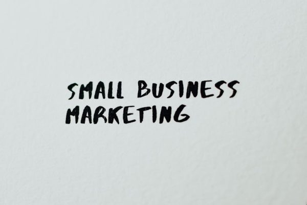 Text 'Small Business Marketing' written on white paper for creative use.