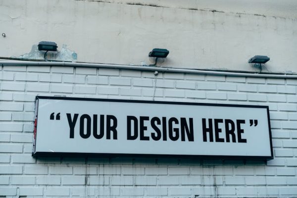 Blank urban wall sign for showcasing custom designs or messages outdoors.
