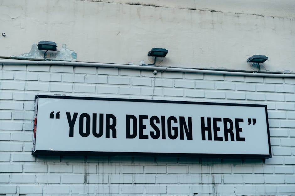 Blank urban wall sign for showcasing custom designs or messages outdoors.