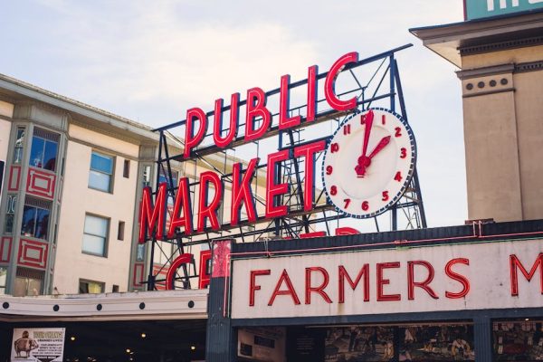 View of the famous Pike Place Market sign in Seattle with the iconic clock tower.