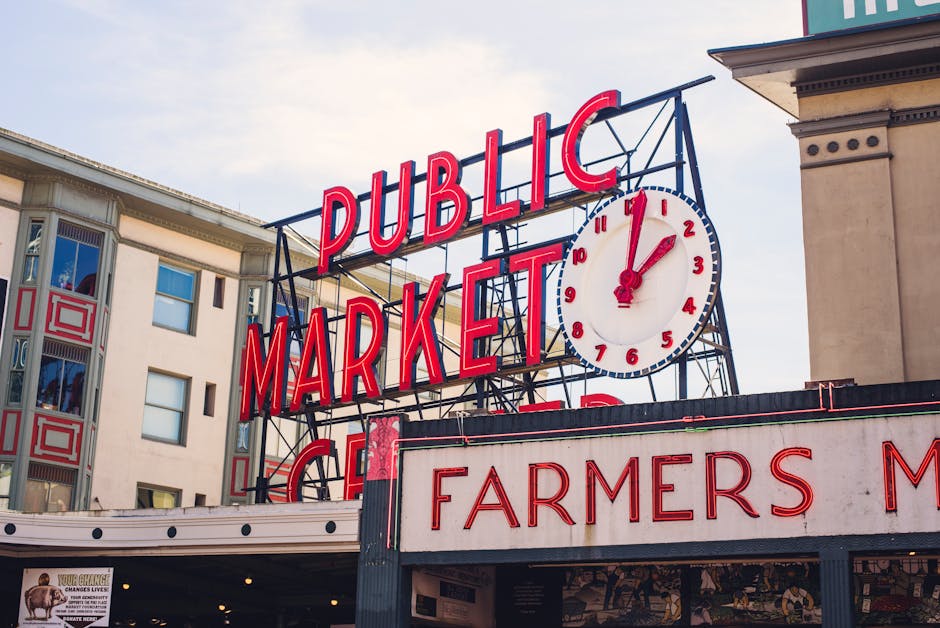 View of the famous Pike Place Market sign in Seattle with the iconic clock tower.