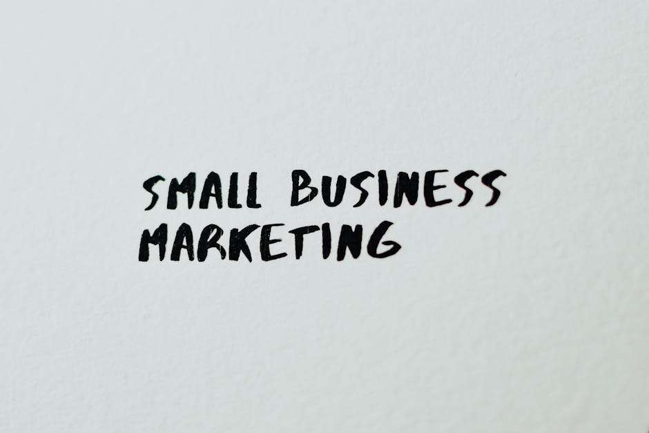 Text 'Small Business Marketing' written on white paper for creative use.