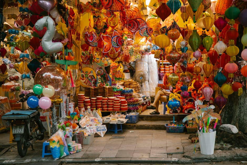 Colorful lanterns and decorations in an outdoor city market stall, perfect for festive celebrations.