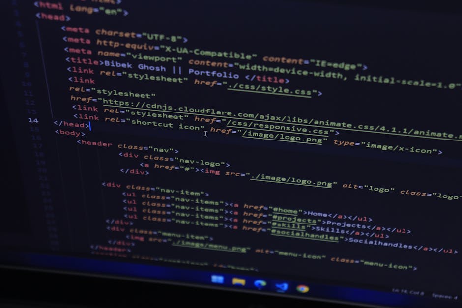 High-resolution close-up of HTML code displayed on a computer screen, perfect for technology themes.