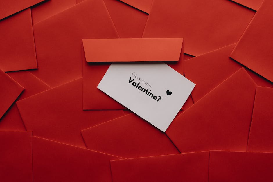 Stylish Valentine’s greeting card surrounded by red envelopes. Perfect for love and romance themes.