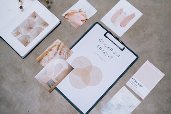 Flat lay showing branding materials and design concepts for creative strategy discussions.