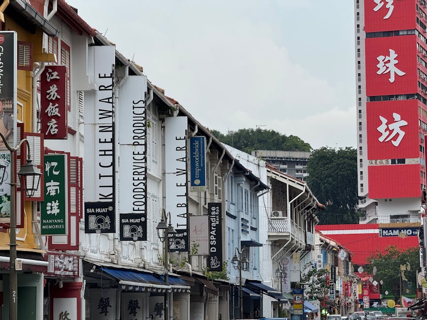 Vibrant street view in Chinatown showcasing diverse shop signage and cultural architecture.