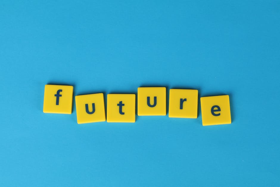 Yellow letter tiles spelling 'future' on a blue background, emphasizing creativity and optimism.