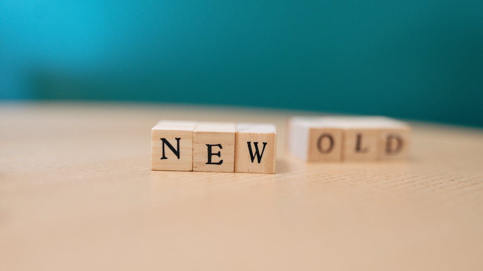 Wooden blocks displaying the words 'NEW' and 'OLD', symbolizing change.