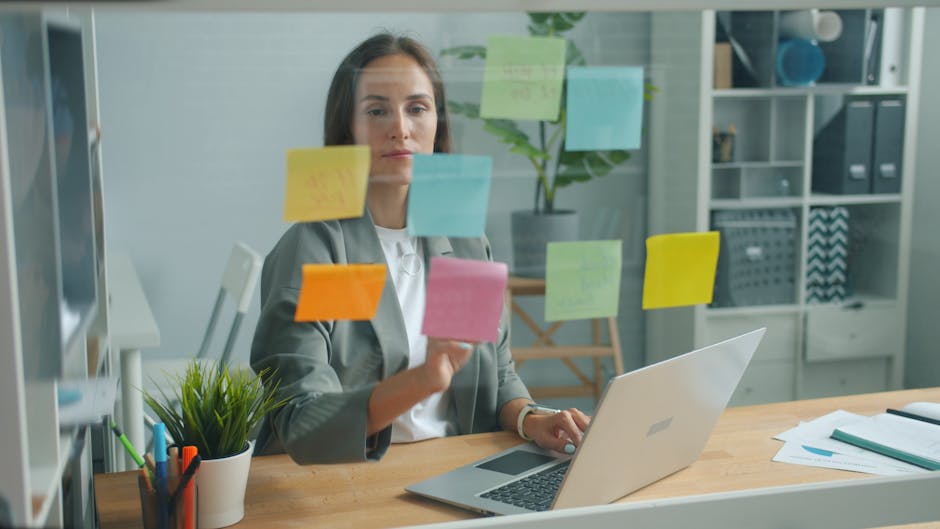 Businesswoman strategizing with sticky notes in a modern office environment.