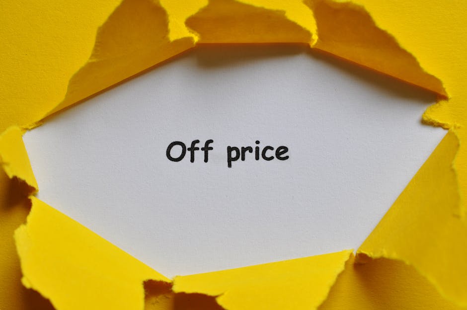 Yellow paper torn open to reveal 'Off Price' text, perfect for sales and discounts concept.