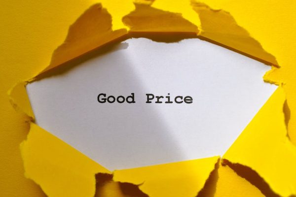 Yellow paper torn to reveal 'Good Price'. Perfect for sales and marketing concepts.