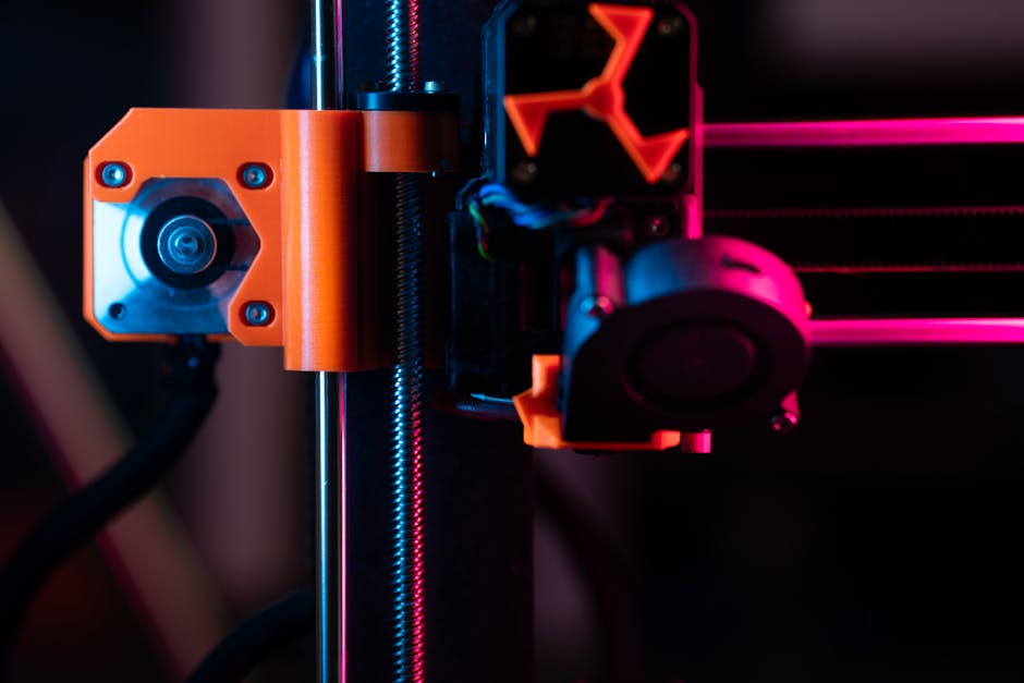 A detailed close-up of a 3D printer showcasing its extruder and components under vibrant lighting.
