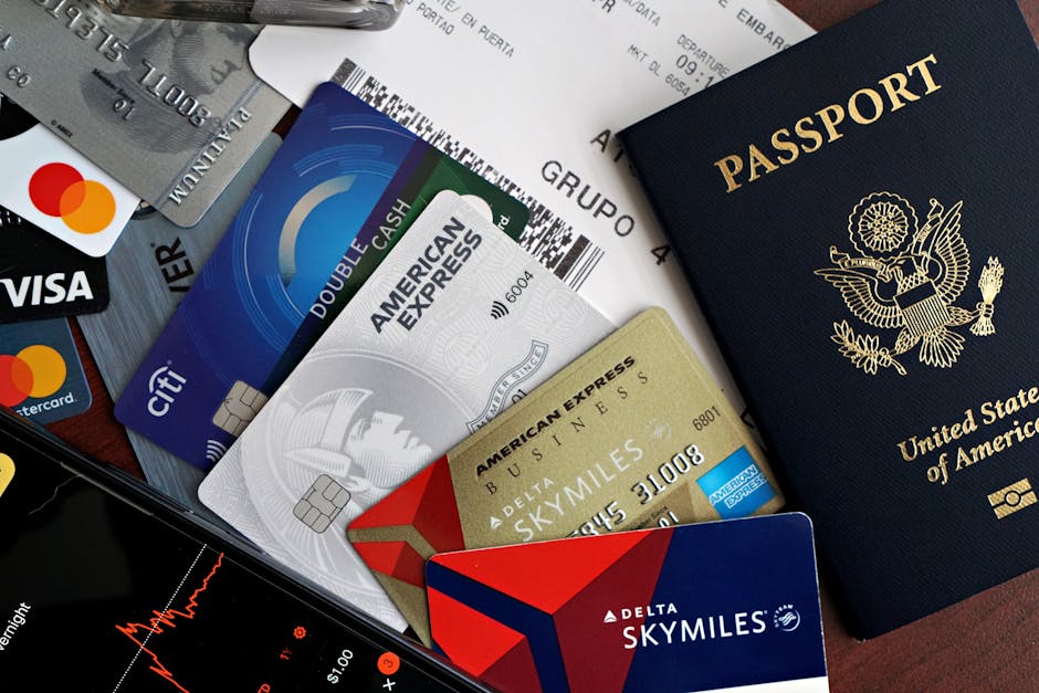A collection of travel essentials including a passport, credit cards, and a boarding pass. Ideal for travel and finance concepts.