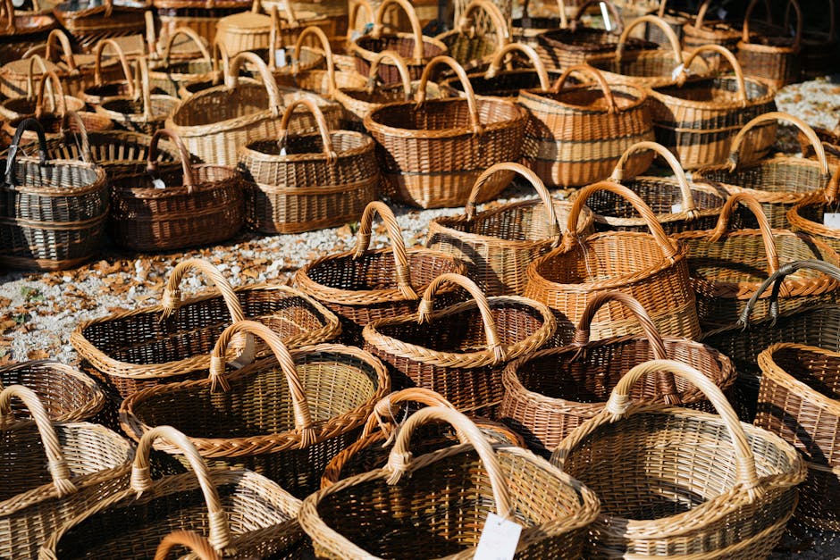 Assorted handmade wicker baskets displayed in an outdoor market setting.