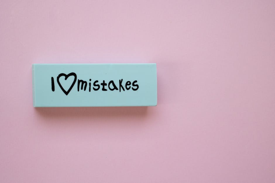 Minimalist eraser with 'I Love Mistakes' message on pink background, school stationery.