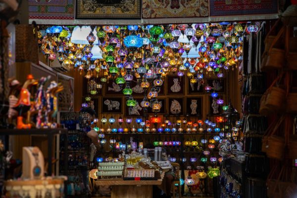 Explore a dazzling array of colorful Turkish lamps in a lively Singapore bazaar.