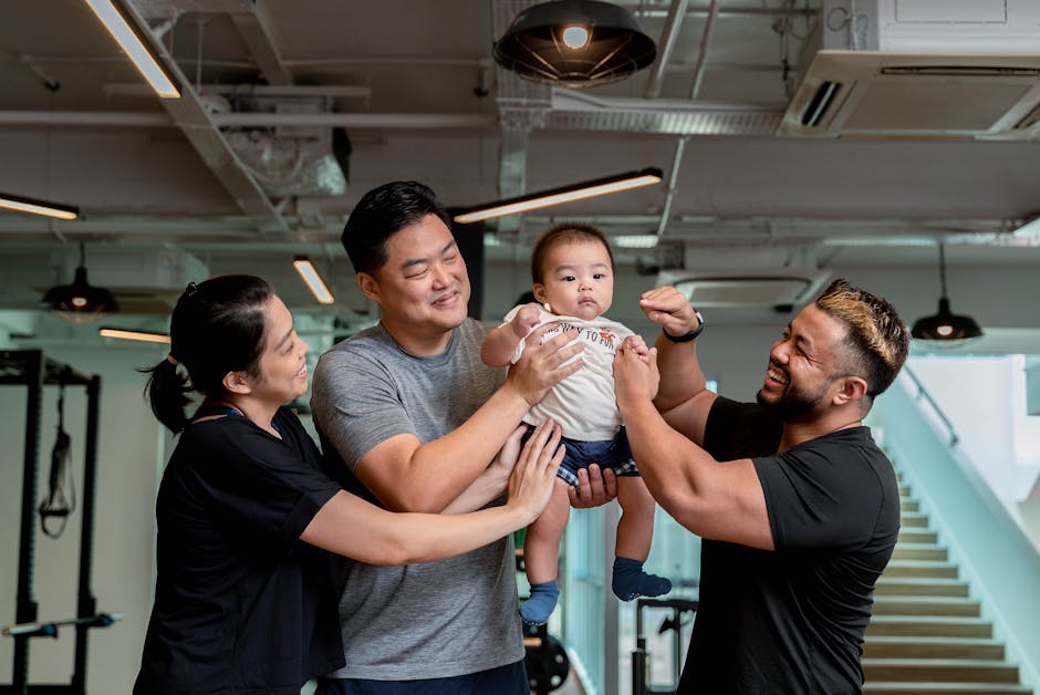 A joyful family moment captured indoors at a gym in Singapore, showcasing happiness and unity.