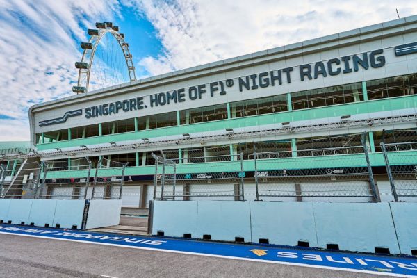 Empty Singapore Grand Prix F1 circuit during the day, showcasing race track and Singapore Flyer.