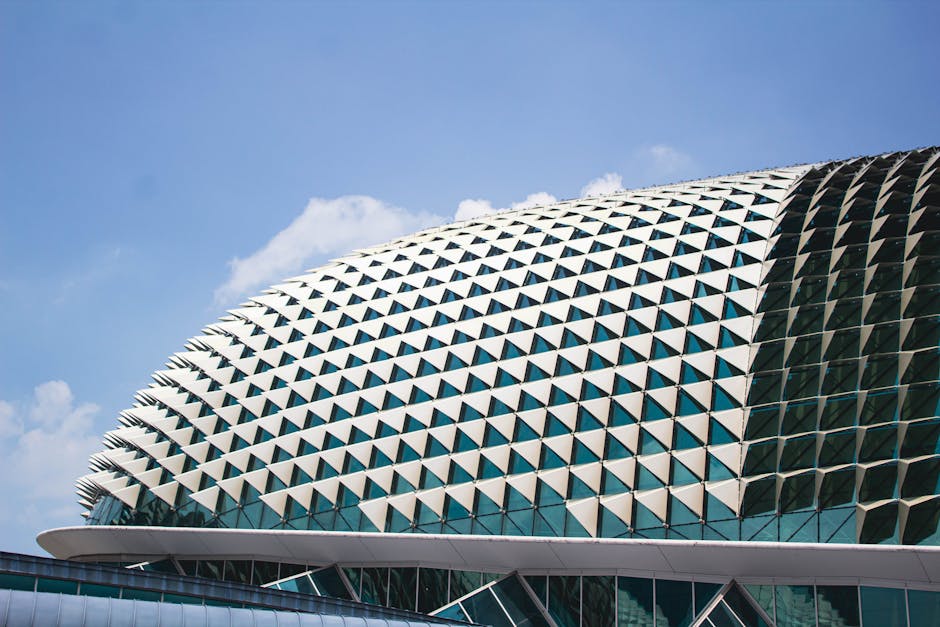 Dome architecture of Esplanade in Singapore under a clear blue sky.