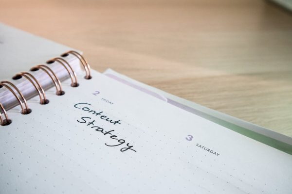 Close-up of a notebook page with 'Content Strategy' written on it, ideal for business planning visuals.