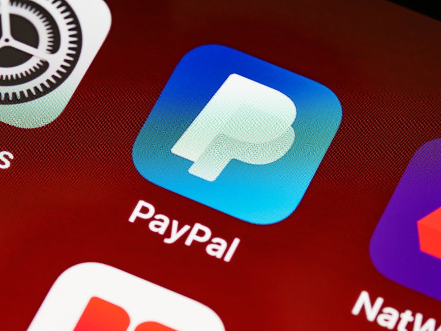 Detailed view of PayPal app icon on a smartphone screen highlighting mobile payment technology.